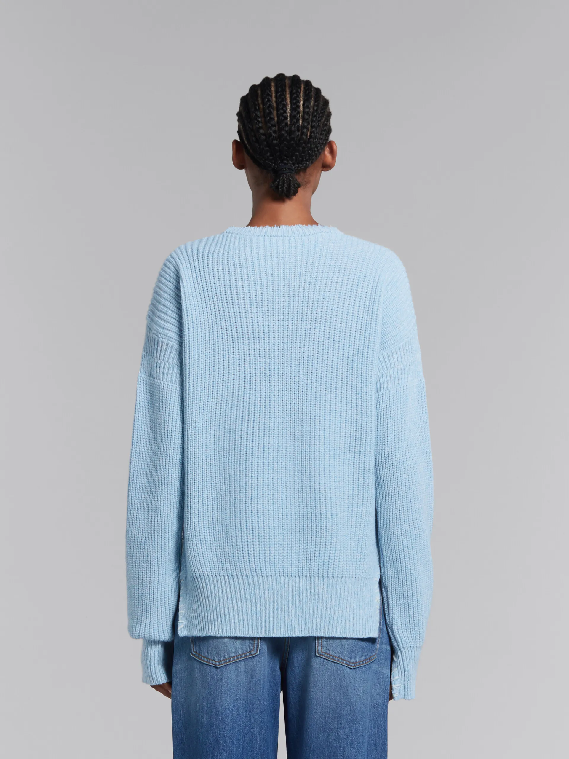 Maglione mouliné blu con impunture a contrasto