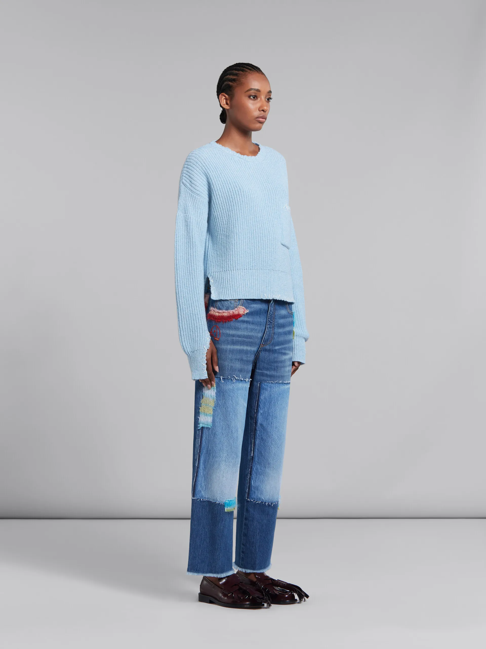 Maglione mouliné blu con impunture a contrasto