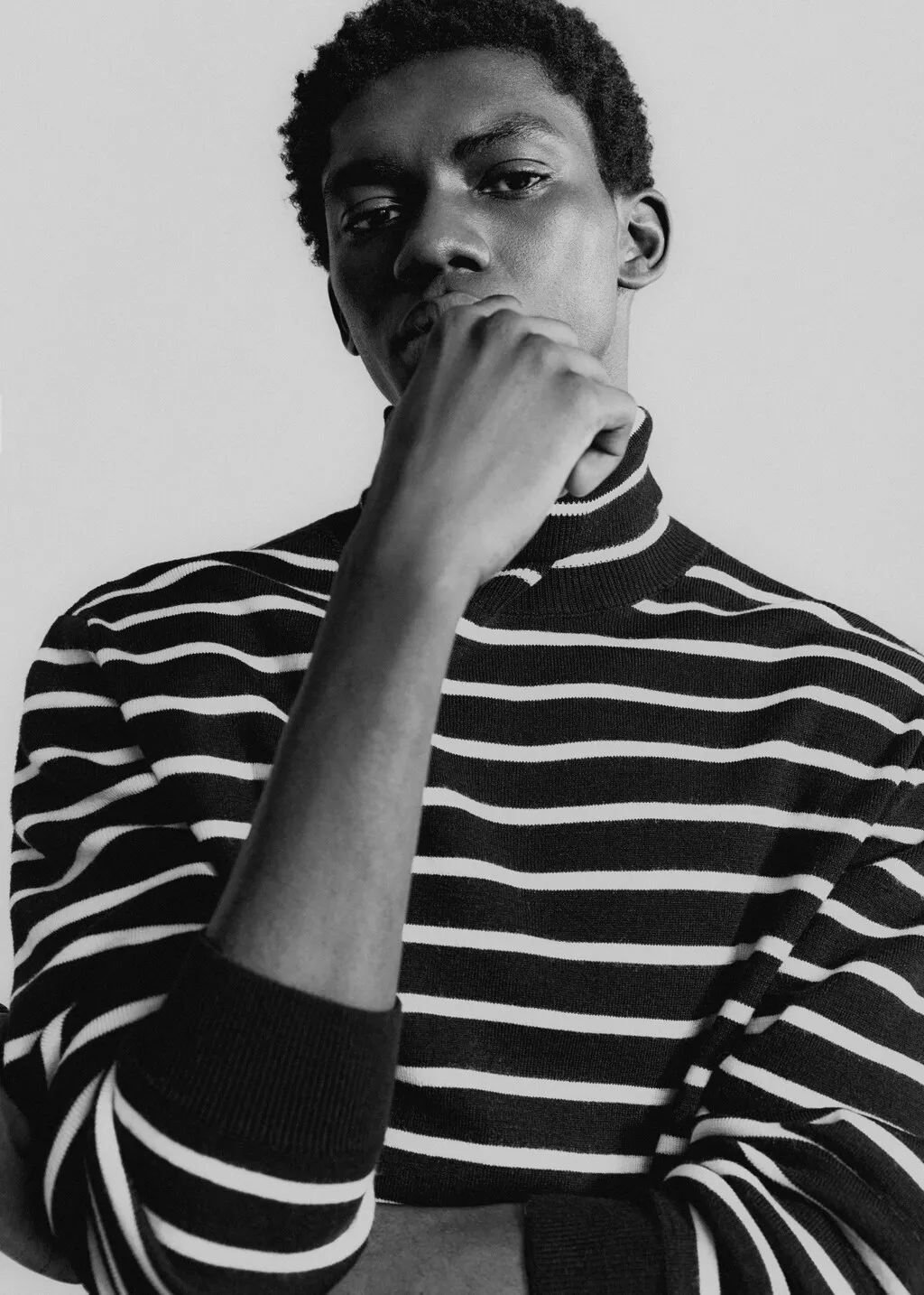 Pullover righe collo alto